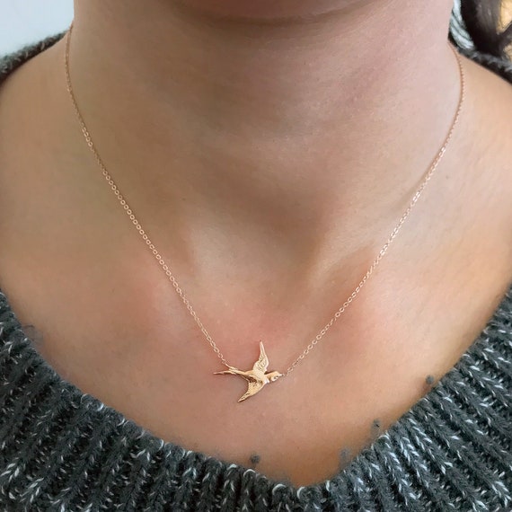 Gold sparrow necklace deals