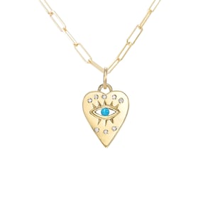May include: Gold necklace with a heart-shaped pendant featuring a turquoise evil eye design with diamond accents.
