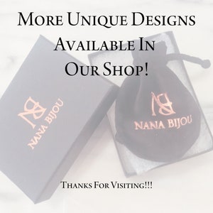 May include: A black box with the text "NANA BIJOU" in gold lettering. A black velvet bag with the same text in gold lettering is sitting on top of the box. The text "MORE UNIQUE DESIGNS AVAILABLE IN OUR SHOP! THANKS FOR VISITING!!!" is written in white text on a white background.
