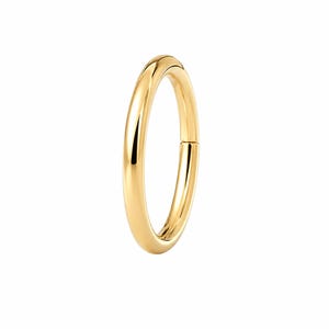 May include: A polished gold-tone circular hoop ring featuring a smooth, seamless surface and a hinged closure mechanism. The metal has a reflective, high-shine finish that catches the light, creating a clean and simple continuous loop design.
