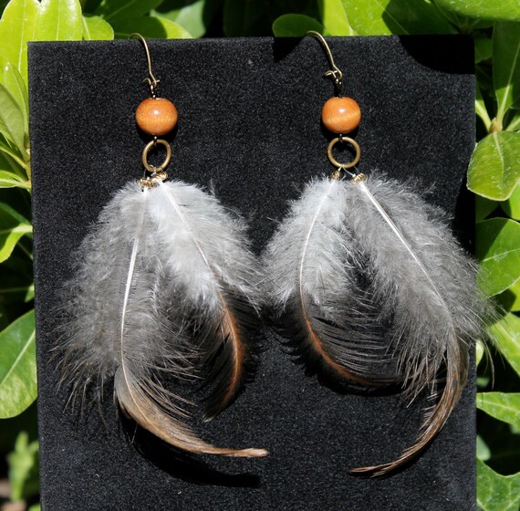 Items similar to Wood Beads with Feathers on Etsy
