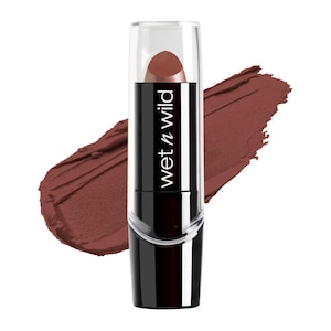 May include: A tube of Wet n Wild lipstick in a deep brown shade. The lipstick is in a black and silver tube with a clear cap. A swatch of the lipstick color is visible in the background, showing the color's depth and texture.