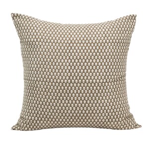 May include: A brown and white patterned throw pillow with a square shape.