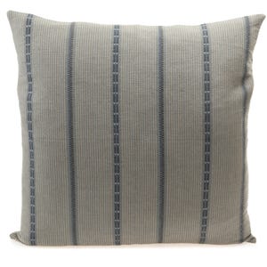 May include: A gray and blue striped throw pillow with a subtle texture. The pillow is made of a soft, woven fabric.