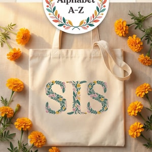 Floral embroidery font mockup on cream canvas tote bag surrounded by golden marigold flowers. Word SIS embroidered in botanical teal green letters with yellow daisies and pink blooms. Curved arch title and colorful Full Alphabet A-Z wreath badge. Commercial use OK. Perfect for personalized sister gift. 26 letters, 6 sizes 3.5 to 6 inch, 10 formats. PES DST JEF XXX VP3 VIP HUS EXP ART SEW.