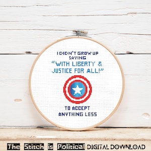 May include: A cross-stitch embroidery in a wooden hoop. The design features text that reads "I DIDN'T GROW UP SAYING 'WITH LIBERTY & JUSTICE FOR ALL!' TO ACCEPT ANYTHING LESS." A shield graphic is in the center. The text "The Stitch is Political DIGITAL DOWNLOAD" is at the bottom.