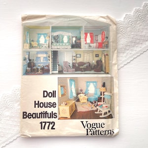 May include: A Vogue Patterns envelope for Doll House Beautifuls 1772, featuring illustrations of a multi-room dollhouse with miniature furniture, including a rocking chair, bed, and sofa, set against a cream background with black printed text.