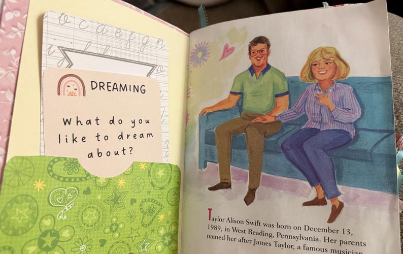May include: A book with a green and white patterned cover. The book has a sticker on the front that says "DREAMING" and asks "What do you like to dream about?" The book also has a picture of a man and a woman sitting on a couch.