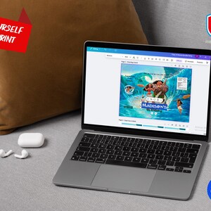 May include: A laptop displaying a colorful digital design with the text "Madison's". The laptop is open on a gray couch next to a brown pillow and white earbuds. The words "Edit Yourself and Print" are in a red banner.