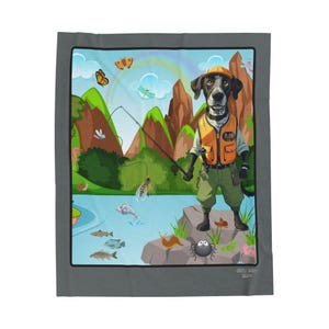 May include: A gray blanket featuring a cartoon illustration of a dog dressed as a fisherman. The dog stands on a rock near a lake, holding a fishing rod. The background includes mountains, fish, and insects.