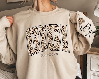 Custom Leopard Gigi Sweatshirt With Kid Name On Sleeve, Personalized Gigi Sweatshirt, Gift For Gigi, Christmas Gift Gigi Est 2026 Sweatshirt