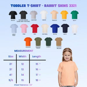 May include: A range of toddler t-shirts in colours such as black, white, pink, and blue. The image includes a size chart with measurements in inches, which are 30.5 cm, 33 cm, 35.5 cm, and 38 cm for width and 39.3 cm, 42 cm, 43.2 cm, and 47 cm for length. The text reads "TODDLER T-SHIRT - RABBIT SKINS 3321".