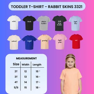 May include: A collection of Rabbit Skins 3321 toddler t-shirts in white, black, athletic heather, dark grey heather, light blue, natural, royal, peachy, light pink, and red. A measurement chart lists widths and lengths in inches for sizes 2T to 5/6.