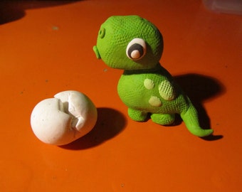 Baby dinosaur cake topper