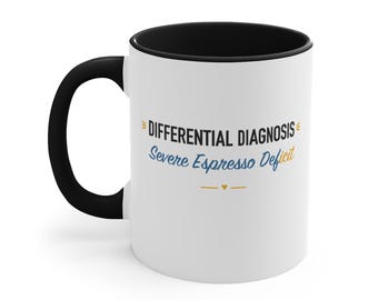Taza negra con detalles decorativos: diagnóstico diferencial de deficiencia grave de espresso.