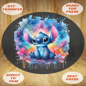 May include: A DTF transfer featuring Stitch from Lilo & Stitch. The design shows Stitch in a watercolour style against a colourful galaxy background. The text "DTF TRANSFER", "READY FOR PRESS", "DIRECT TO FILM", and "HEAT PRESS" are included.