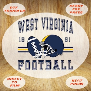 May include: Oval design featuring a football and helmet with the text "WEST VIRGINIA FOOTBALL 18 91". The design is in navy blue, yellow, and white, with the words "DTF TRANSFER", "READY FOR PRESS", "DIRECT TO FILM", and "HEAT PRESS".