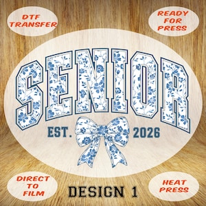 May include: A white oval design featuring the word "SENIOR" in blue floral print lettering, "EST. 2026" and a blue floral bow. The design also includes the text "DTF TRANSFER", "READY FOR PRESS", "DIRECT TO FILM", "DESIGN 1", and "HEAT PRESS".