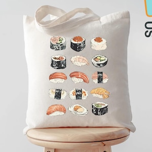 May include: A cream-colored tote bag featuring a colorful illustration of various sushi pieces. The bag has a simple design with a rectangular shape and two handles. The words "Custom ToteBags US" are printed on the side.