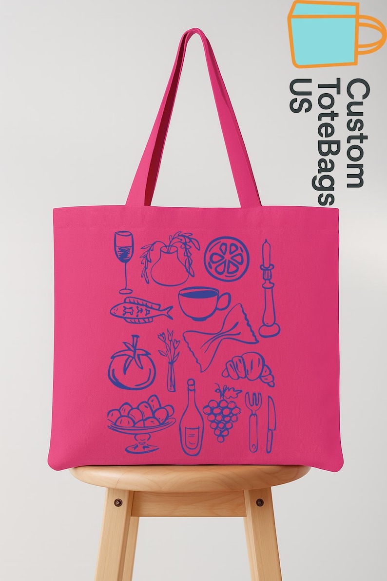 May include: A bright pink tote bag with blue line art illustrations of food and drink items. The bag features a wine glass, fish, coffee cup, pasta, tomato, grapes, and more. The text "Custom Tote Bags US" is printed on the side.