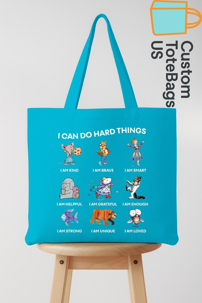 May include: A turquoise tote bag with the text "I CAN DO HARD THINGS" and illustrations of various animals with positive affirmations like "I AM KIND" and "I AM BRAVE". The bag has a matching turquoise handle.