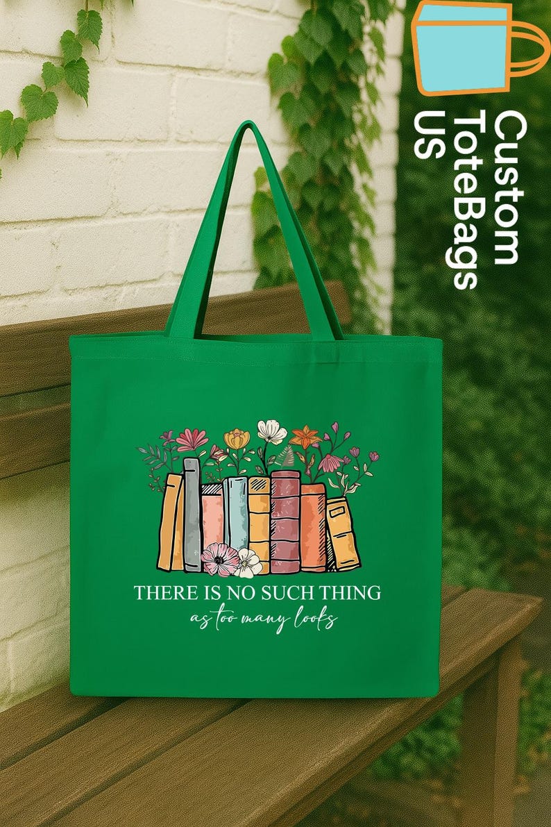 May include: Green tote bag featuring a colorful illustration of books with flowers. The bag has the text "THERE IS NO SUCH THING as too many books". The bag is made of a durable material and has long handles.
