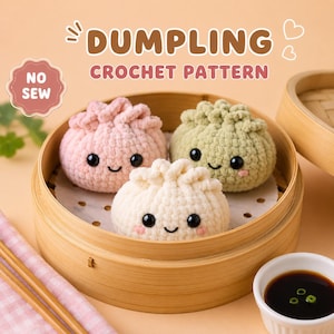 May include: Three plush crochet dumplings in light pink, pale green, and cream colors, each with black safety eyes and a stitched smile, resting inside a round bamboo steamer. Text reads DUMPLING CROCHET PATTERN and NO SEW.