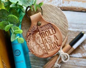 Unmoved. Unshaken. BOLD as a LION. (Proverbs 28:1) leather keyring (camel/natural)