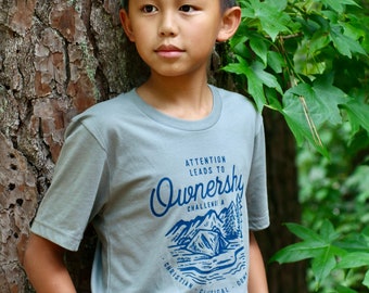 Aufmerksamkeit führt zu OWNERship Challenge A Classical Conversations Unisex Baumwoll-T-Shirt