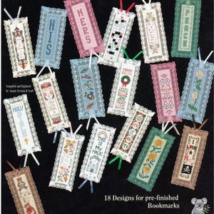 May include: A collection of 18 pre-finished bookmarks with various designs. Each bookmark features a cross-stitch pattern, lace trim, and a ribbon. Designs include text like "HIS", "HERS", and "PEACE", along with floral and other motifs.