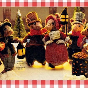 May include: A group of six hand-knitted mouse figures dressed in winter clothing, including hats, scarves, and coats. The mice are standing in a snowy scene with miniature trees and lanterns. Text reads: Compiled & Digitised by Aussie Sewing & Crafts.