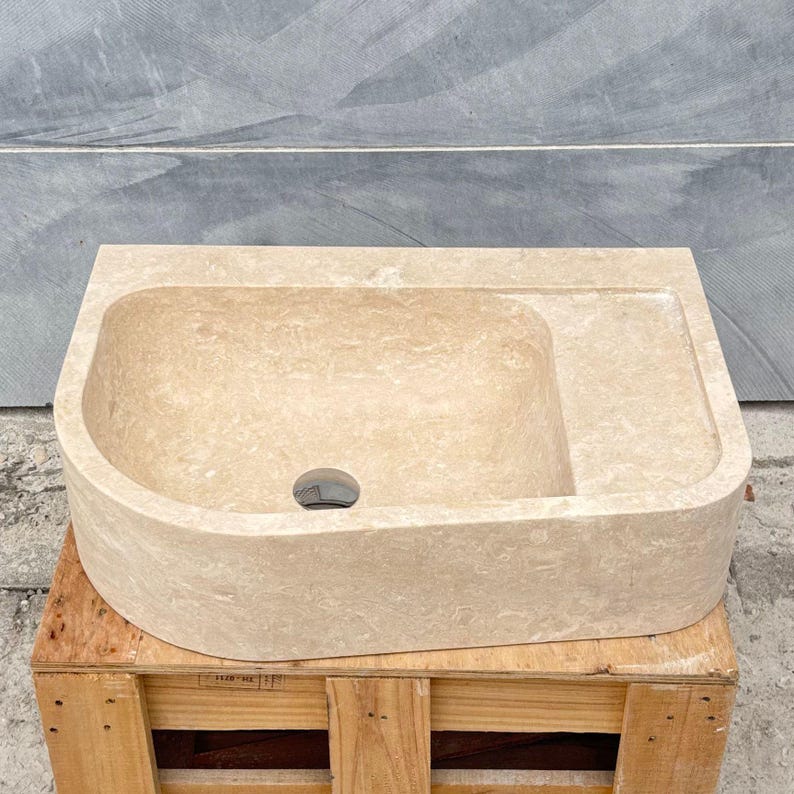 Rectangular travertine marble sink with softly rounded inner basin