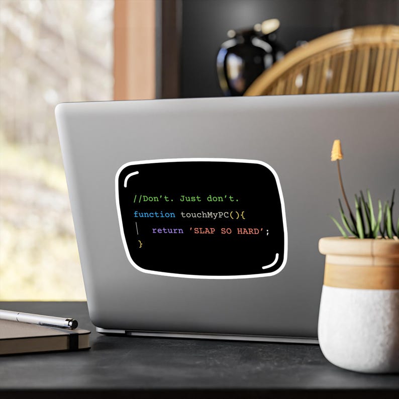 May include: A black sticker with a white border, featuring computer code and the text "//Don't. Just don't. function touchMyPC(){ return 'SLAP SO HARD'; }". The sticker is applied to a laptop.