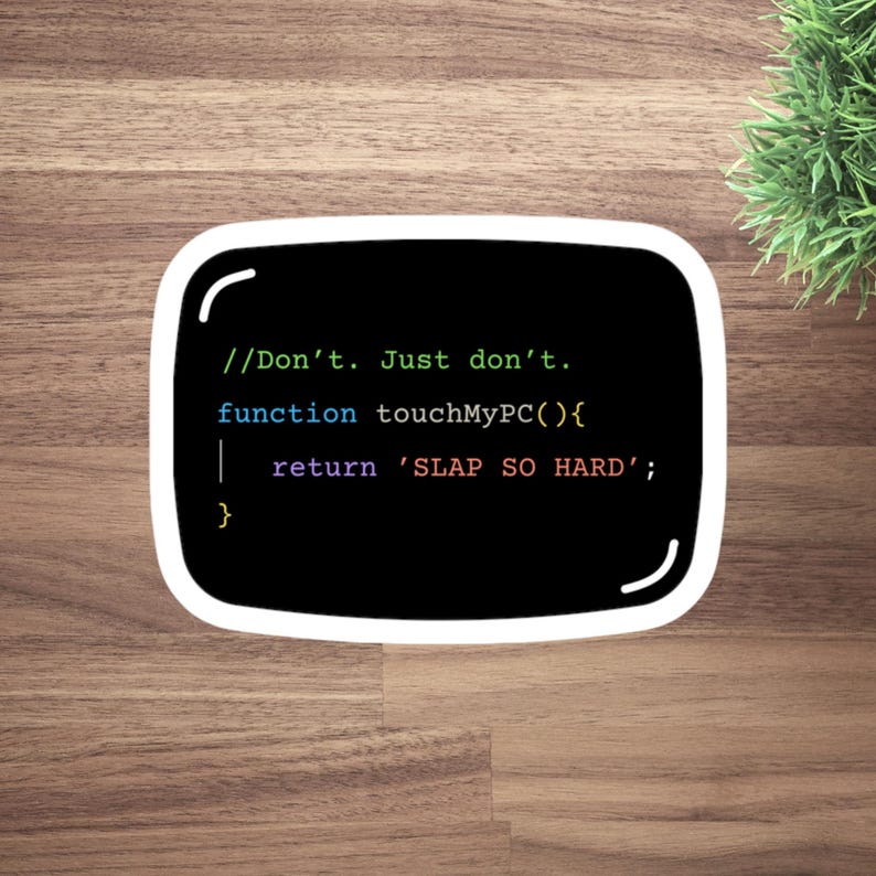 May include: A black sticker with a white border displaying computer code. The text reads "//Don't. Just don't. function touchMyPC(){ return 'SLAP SO HARD'; }". The sticker is on a wooden surface with a small green plant in the background.