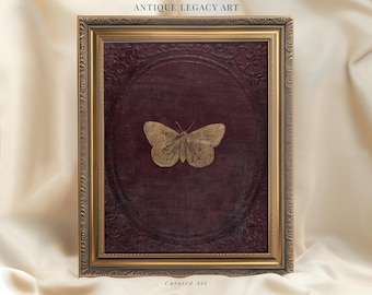May include: A framed artwork featuring a gold-colored butterfly centered on a deep burgundy background. The frame is ornate with a gold finish. The text "ANTIQUE LEGACY ART" is at the top, and "Curated Art" is at the bottom.