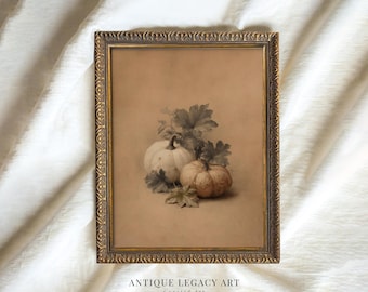 May include: A framed vintage print featuring two pumpkins and foliage in sepia tones. The artwork is set against a tan background and framed in a gold-colored ornate frame. The text "ANTIQUE LEGACY ART Curated Art" is at the bottom.