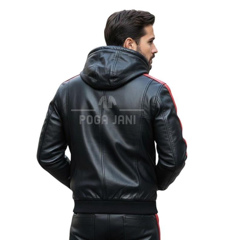 May include: Black leather jacket with a hood and red stripes on the shoulders. The jacket has a ribbed hem and cuffs. The text "POGA JANI" is printed on the back of the jacket.