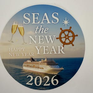 May include: A round sticker with a blue background featuring a cruise ship sailing on the ocean. The sticker has the words "SEAS the NEW YEAR" and "HAPPY NEW YEAR 2026" with champagne glasses and a ship's wheel.