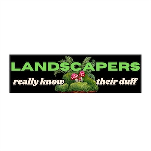 May include: A black rectangular sticker with the words "LANDSCAPERS" in green, above the words "really know their duff" in white. A small, green, mossy landscape with red and white mushrooms is in the center.
