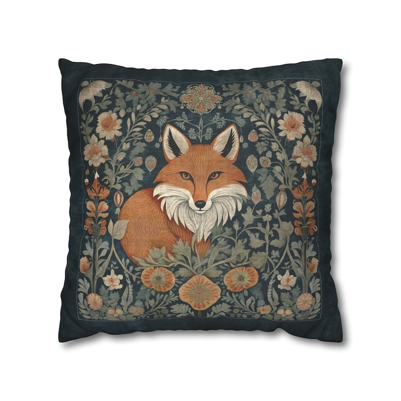 An elegant throw pillow print with a curious fox in an enchanted forest surrounded by flowers and vines. Perfect for boho decor in neutral shades of dark navy blue, copper and beige.