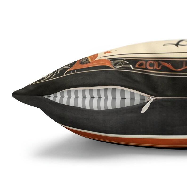 May include: A black and orange throw pillow with a zipper closure. The pillow has a vintage design with a black background and orange accents. The pillow is decorated with a graphic of a vintage car and the text "Don't Worry, Be Happy".