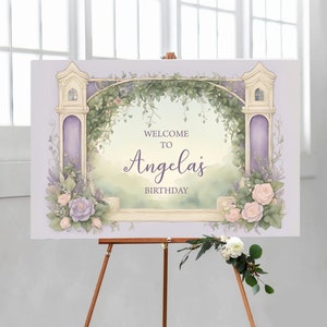May include: A purple and green floral welcome sign with a white archway and the text "Welcome to Angela's Birthday".