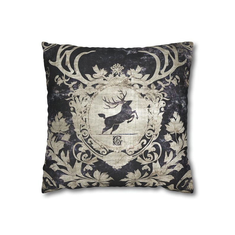 May include: A black and white throw pillow with a vintage design featuring a stag with antlers and a floral pattern.