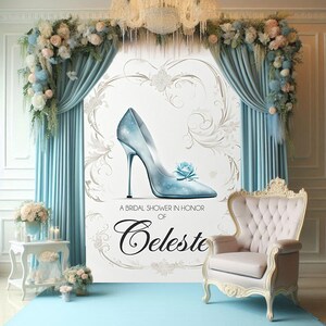May include: A bridal shower backdrop with a light blue glass slipper, white floral designs, and the text "A Bridal Shower in Honor of Celeste".
