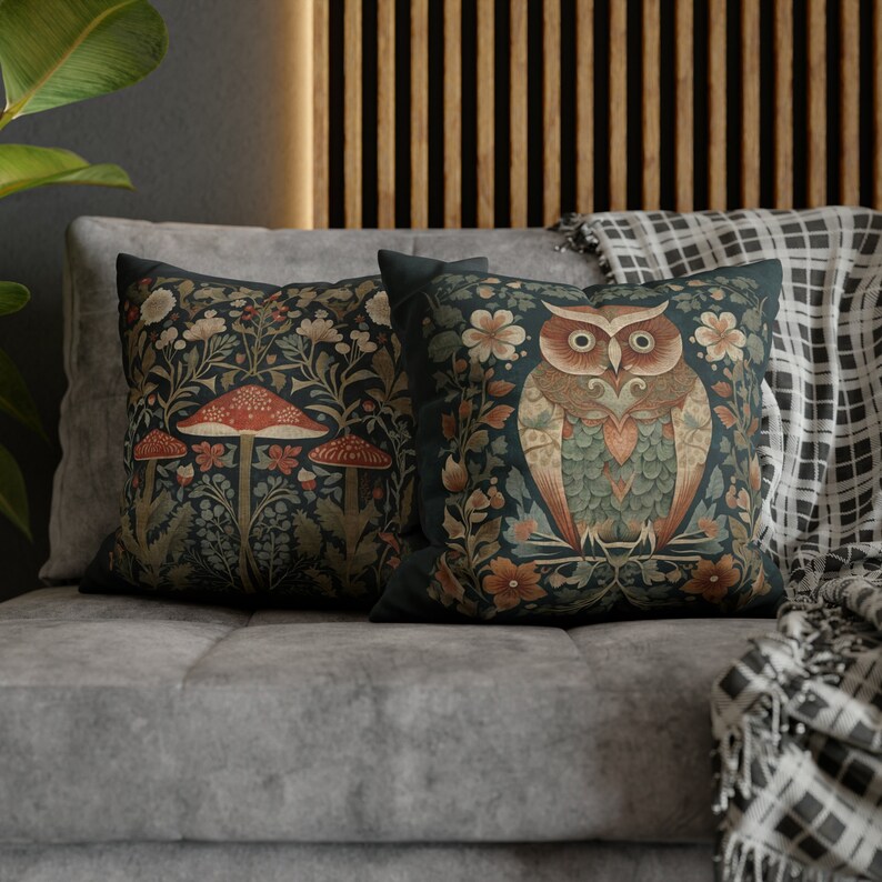 May include: Two decorative throw pillows with a dark green background. One pillow features a stylized owl with a red, green, and brown color scheme. The other pillow features a mushroom with a red cap and a green stem.