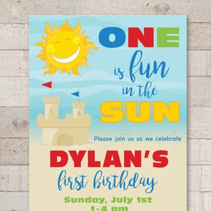 May include: A blue, yellow, red, and green birthday invitation for a boy's first birthday party. The invitation features a sun, a sandcastle, and a beach ball. The text reads "ONE is fun in the SUN Dylan's first birthday Sunday, July 1st 1-4 pm 123 Sandy Drive New York, NY 07123 RSVP to Angela 345-098-1234 Please bring a towel and swimsuit."