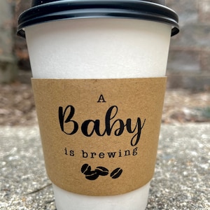 A Baby Is Brewing Coffee Cups With Sleeves