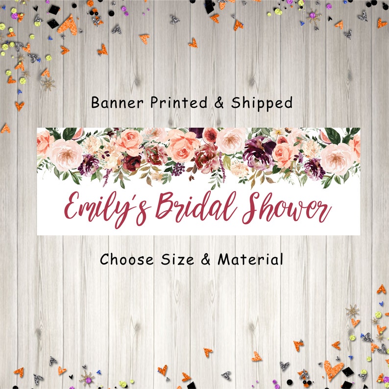 Op de afbeelding: Een witte banner met een bloemige rand in tinten roze, bordeauxrood en groen. De tekst "Emily's Bridal Shower" is geschreven in bordeauxrode cursieve letters. De banner bevat ook de tekst "Banner Printed & Shipped" en "Choose Size & Material".