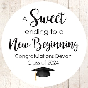 May include: A white circle with black text that reads "A Sweet ending to a New Beginning Congratulations Devan Class of 2024". A black graduation cap with a gold tassel is at the bottom of the circle.