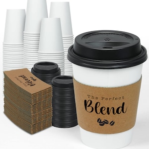 May include: White paper coffee cups, black lids, and cardboard sleeves with the text "The Perfect Blend" and coffee bean graphics. Stacks of cups and sleeves are visible, suggesting a bulk purchase.